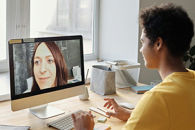 Student talking to teacher on video conference