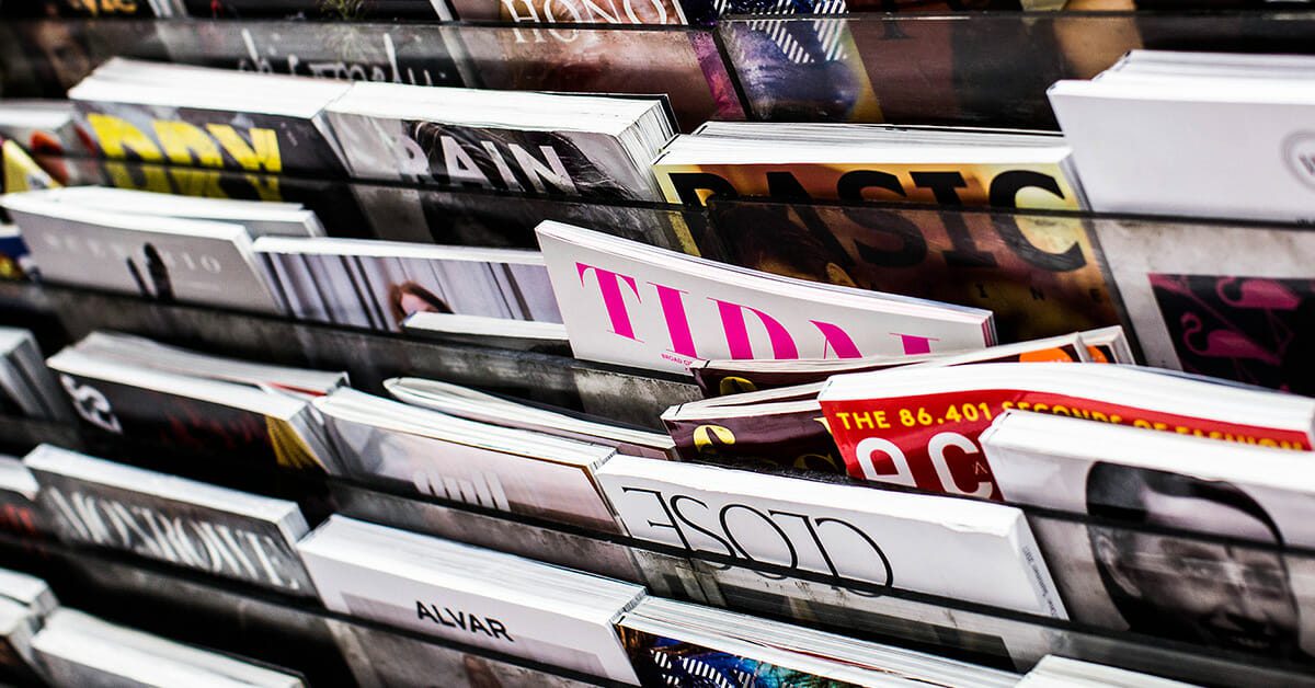 Various magazines for sale on a rack
