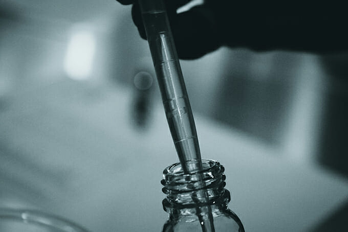 close up of a dropper used by a cannabis lab chemist